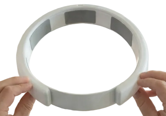 Hands holding the MetroBand Pro wearable metronome headband demonstrating hands free EOG based tempo control