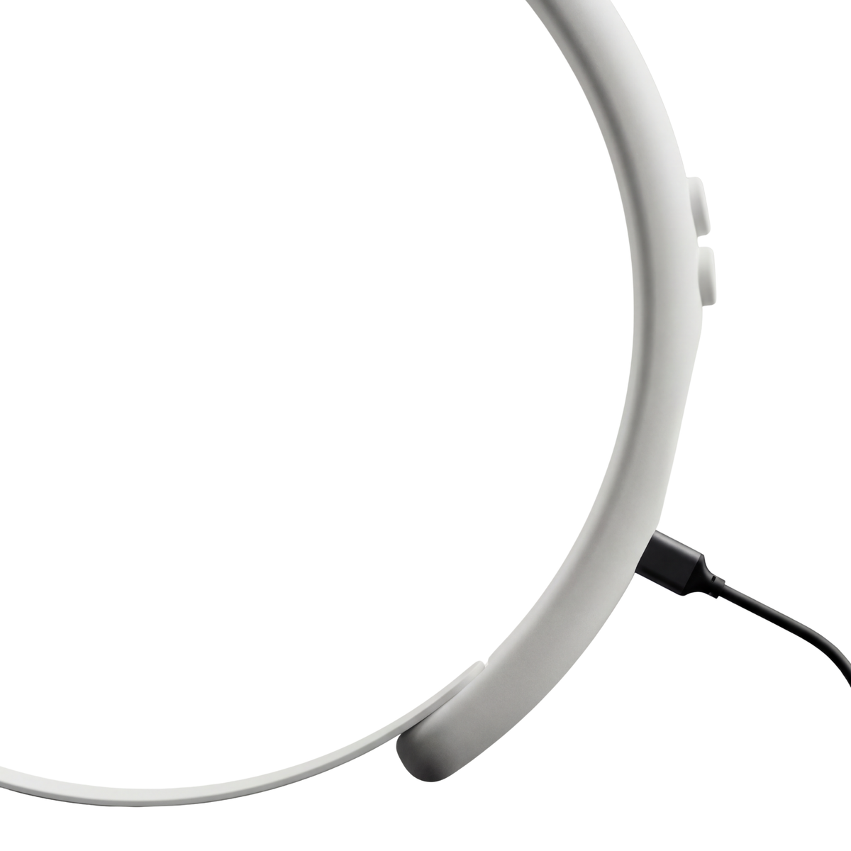 MetroBand wearable metronome headband connected to a USB-C charging cable on a white background